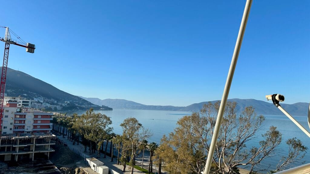 View from high rise apartment of the Vlore coastline in Albania. Showing the sea and mountain range.