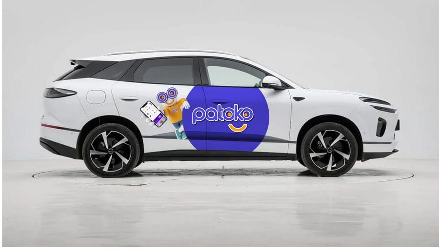 White Patoko taxi in Tirana with the Patoko logo on the door